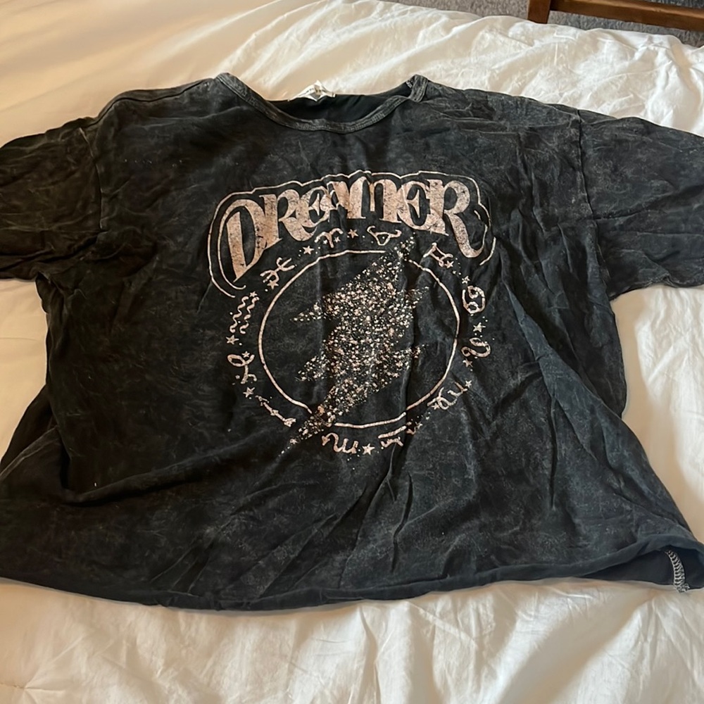 T Shirt by “Caution to the wind”